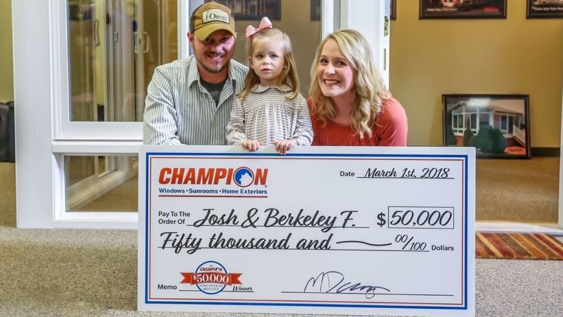 Champion contest winners with check
