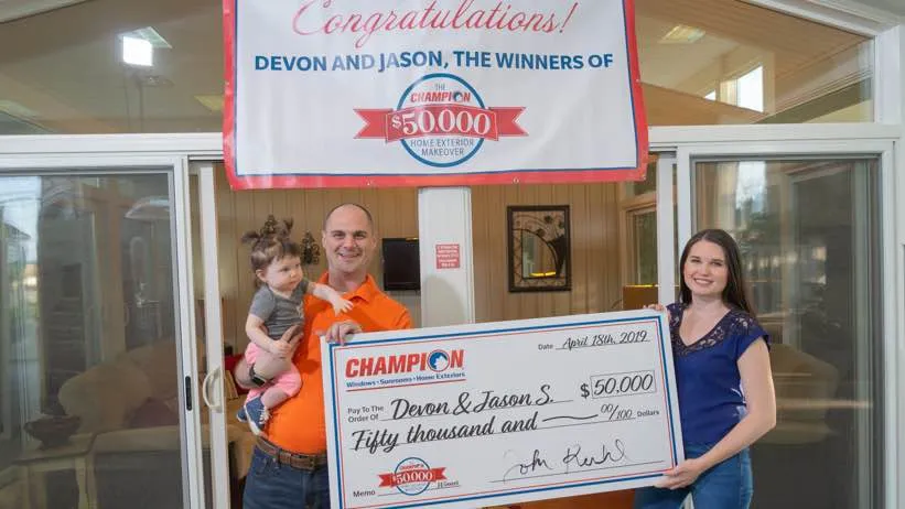 Champion contest winners with check
