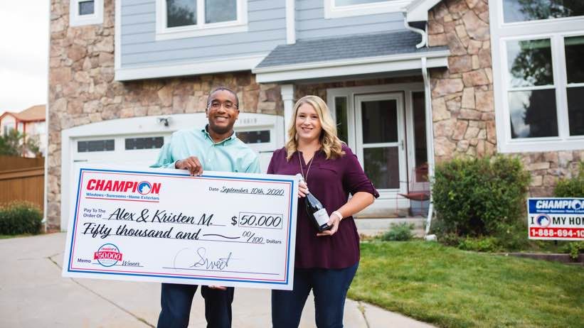 Champion contest winners with check