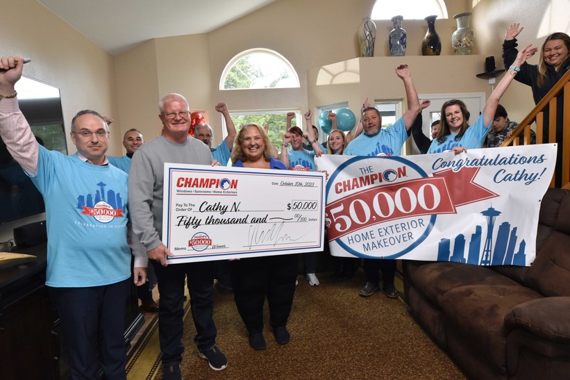 Champion contest winners with check