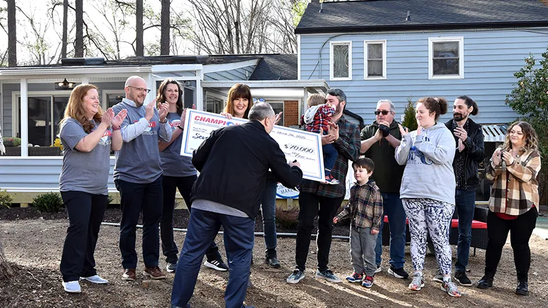 2023 Champion contest winner with check