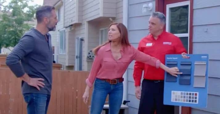 Champion employee showing siding options to customers