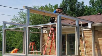 Champion installer working on longer sunroom installation process