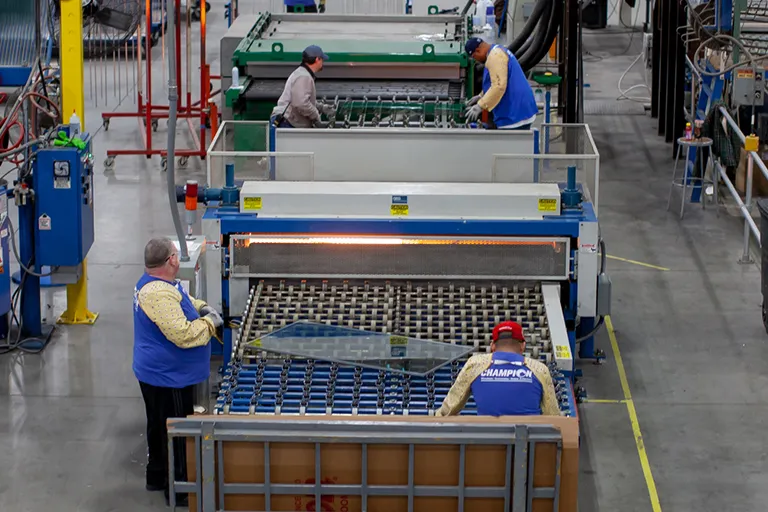 Champion employees assembling window frames