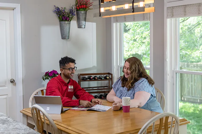 Champion employee showing a customer window options