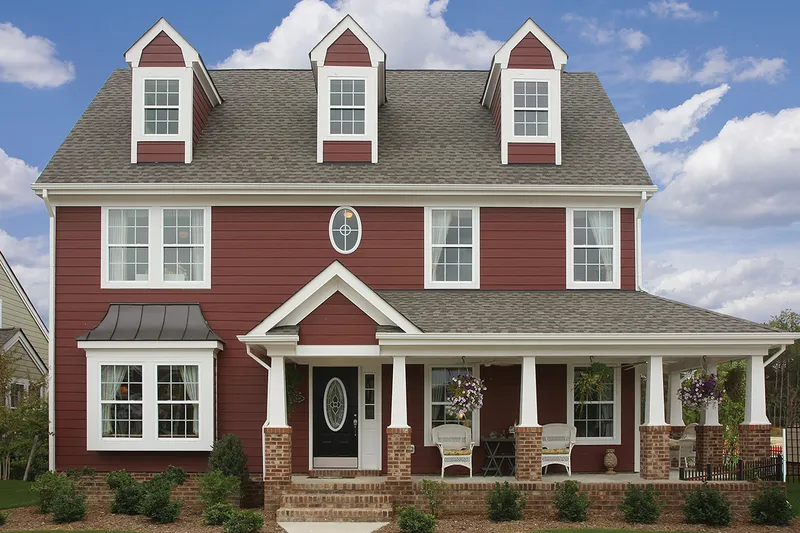 Red house with fiber cement siding.