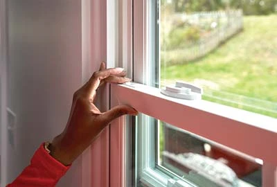 Person sliding window tilt latches