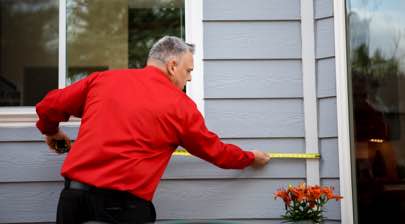 Champion installer making measurements