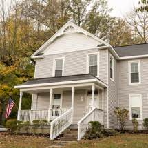 Photo of home with half round shake siding