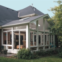 Woman reading a book in her Champion sunroom
