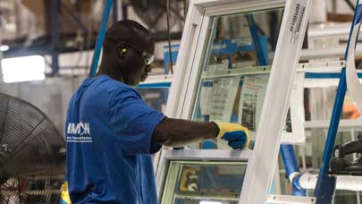 Champion employee working on window