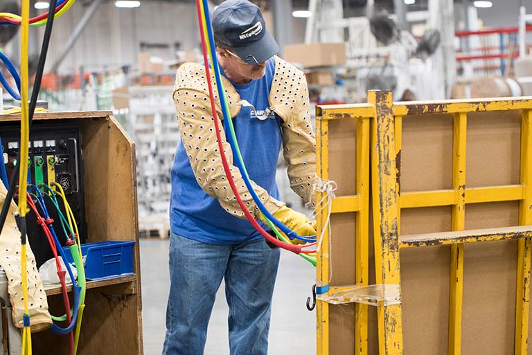 Champion employee filling window with argon gas