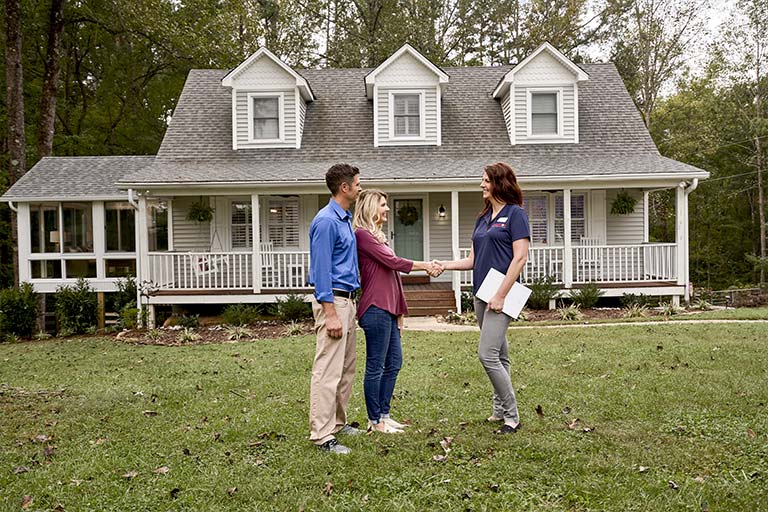 Champion employee shaking hands with customer